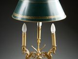 an image of a table lamp with a green shade on top of it