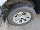 a close up of a tire on the side of a truck