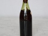 a bottle of wine that is sitting on a table