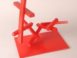 sculpture of a red sculpture of a cross on a red base