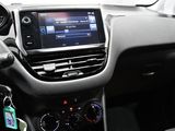 the interior of a car with a steering wheel and dashboard controls