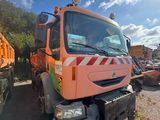 a large orange truck that is parked on the side of the road