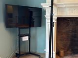a fireplace and a television in a room with blue walls