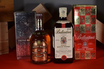 a bottle of whisky and a box of cigarettes on a table