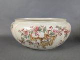 a white bowl with a floral design on it