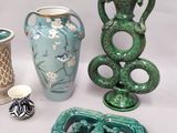 many different vases that are sitting on a table