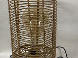 a light that is sitting in a basket on a table