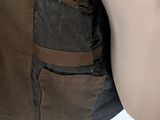 a male mannequin wearing a brown vest and a brown hat