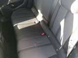 the back seats of a car are black and grey