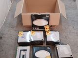 a lot of electronic devices in a box on the floor