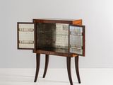 an image of a small cabinet with a glass door on it