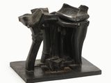 sculpture of a pair of boots and a hat on a stand