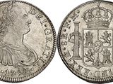 a silver coin with the image of a woman in a crown on it