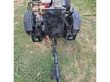 an image of a lawn mower with a lawn mower attached to it