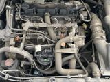 a picture of a car engine with its hood open
