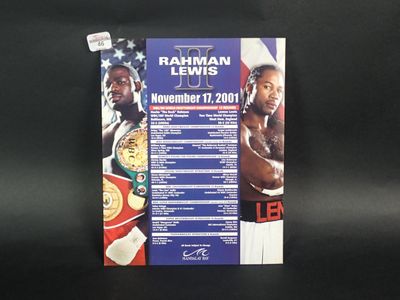 a close up of a poster on a black surface