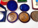 a lot of medals and medals on a table