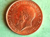 a penny on a table with a green background