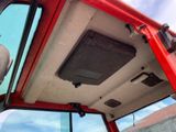 a close up of the inside of a red truck