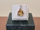 an image of a ring with a yellow stone in it
