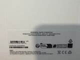 the back of a white box with a picture of a person holding a cell phone