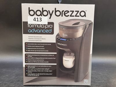 the box of the babybrezza machine is open on the table