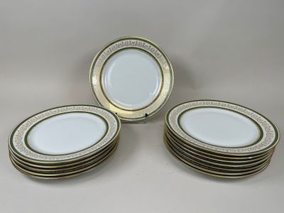 six white and gold plates with gold trims on them