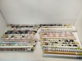 many rolls of paper on a shelf in a box