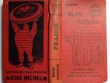 an old red book with a picture of a little boy holding a frisbee on top of it