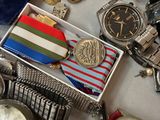 a lot of watches and other watches on a table