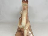 a small figurine of a man sitting on a table
