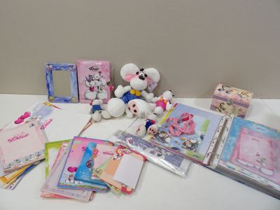 a white table topped with lots of cards and stuffed animals