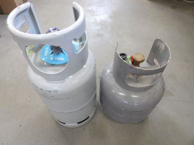 a propanene and a propanene bottle on the floor