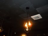 three lights hanging from the ceiling in a dark room