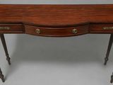 a small wooden table with two drawers and a drawer underneath it