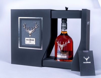 a bottle of dalmore single malt whisky in a black box