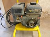 a small machine that is sitting on a yellow stool