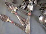 a lot of spoons and spoon spoons on the table