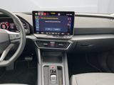 the interior of a car with a touch screen and steering controls