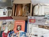 a box full of stamps and envelopes sitting on a table