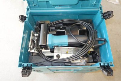 a blue tool box with tools in it on the floor