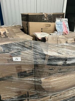 a large pile of boxes that are wrapped in plastic
