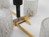 someone is using a drill to make a piece of ice