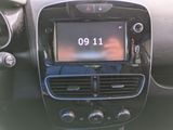 a picture of a car dashboard with a clock on it