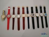 several different types of watches are lined up on a table