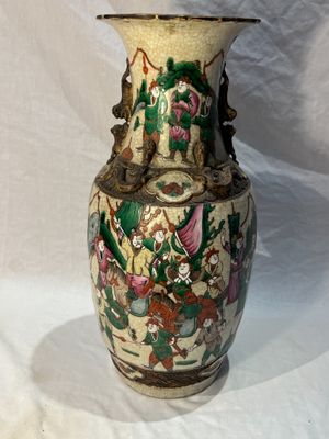 a vase that is sitting on a white surface