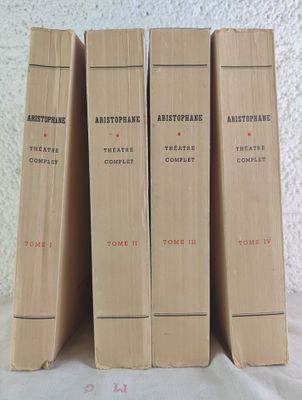 three books are stacked on top of each other on a table