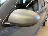 a close up of a car ' s side mirror in a showroom