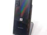 a picture of a samsung galaxy note 10 lite phone on a stand