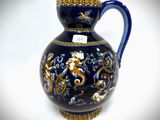 a blue vase with a gold and blue design on it